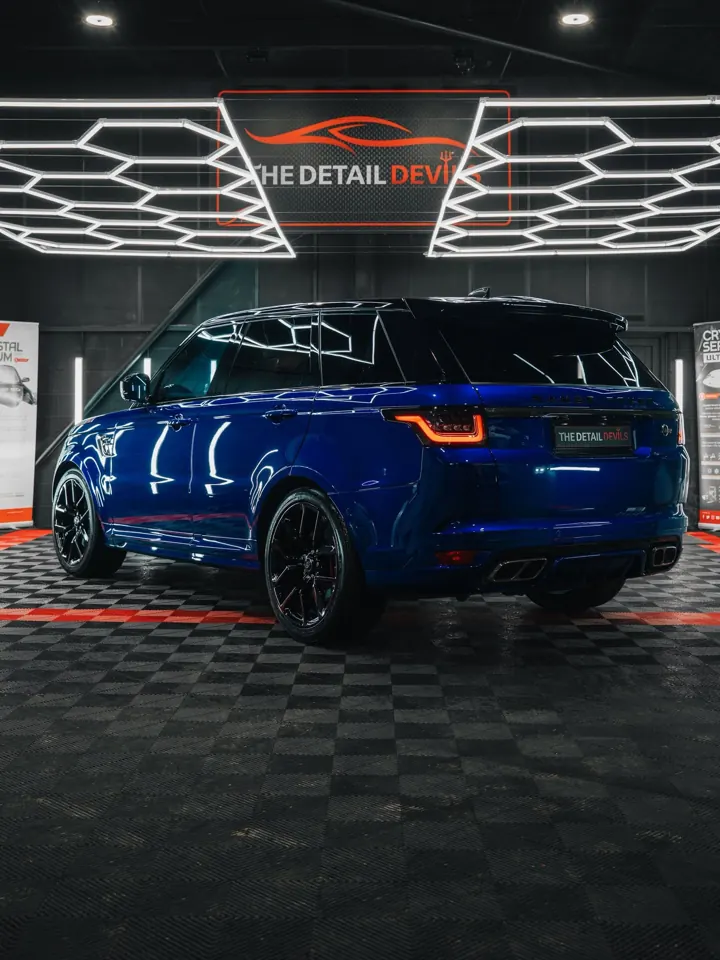 Range Rover Sport SVR rear three-quarter under the sign